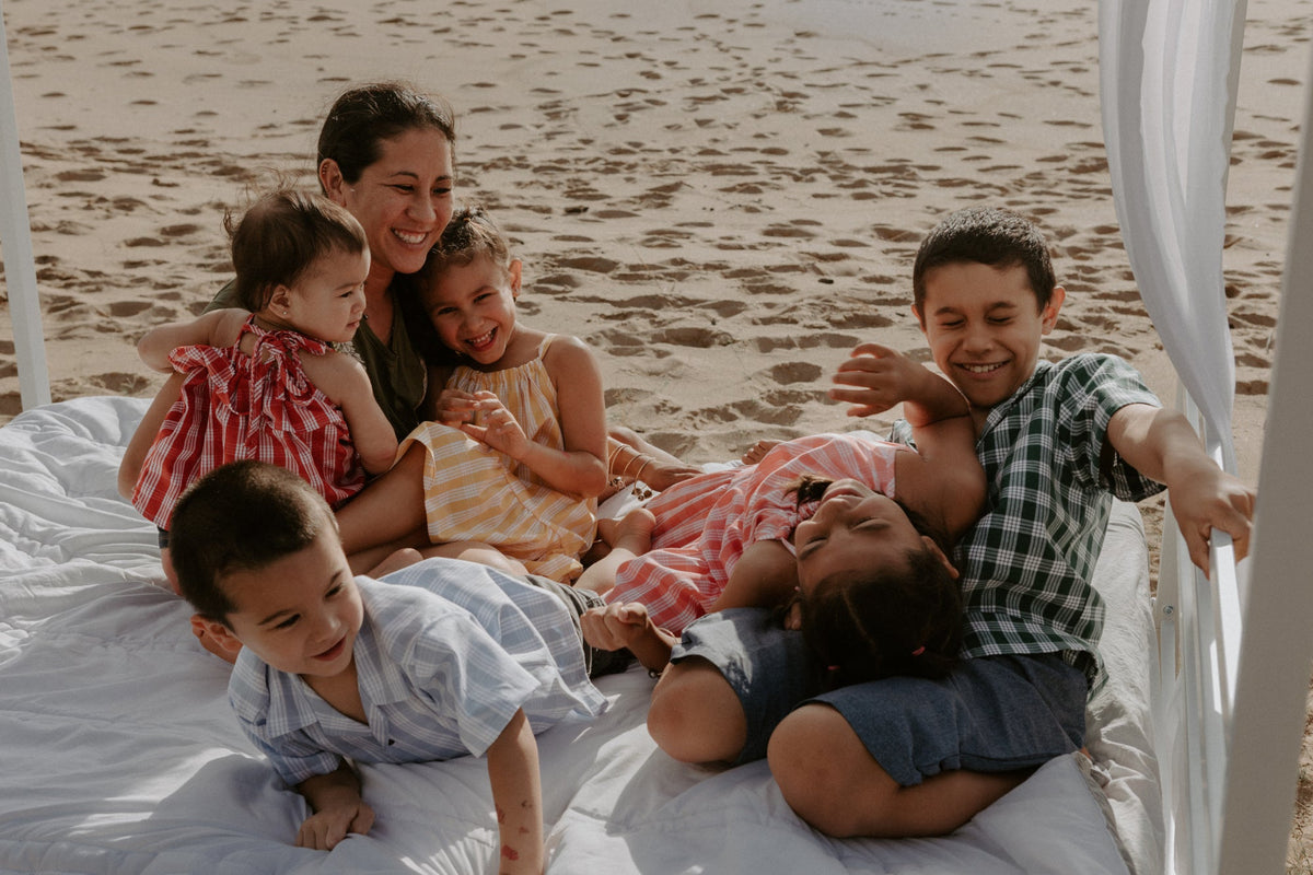The Keiki Dept founder Leiliani Sills and her children wearing her designs.