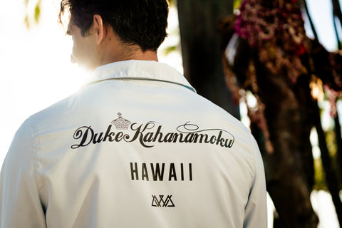 Man wearing a Duke Kahanamoku branded windbreaker from Ambassadors with Aloha