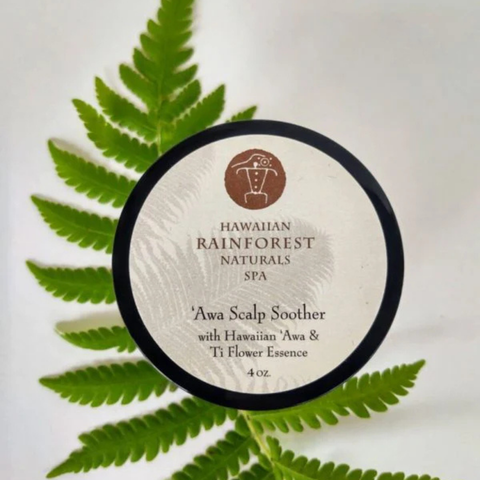 Hawaiian Rainforest Naturals Spa product with fern leaves on a light background