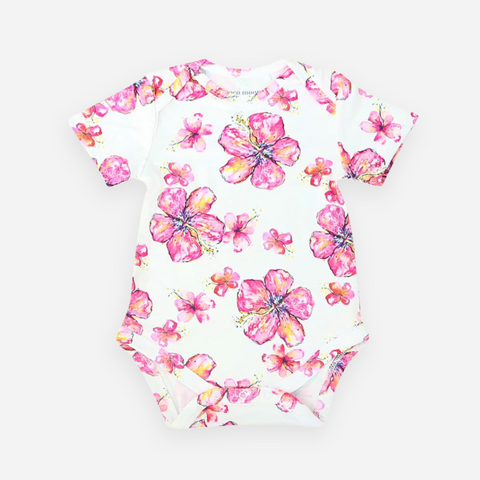 White baby onesie with pink floral pattern on a white background