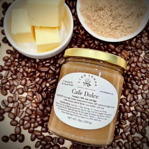Jar of 'Cafe Dolce' spread on coffee beans with butter and brown sugar in the background
