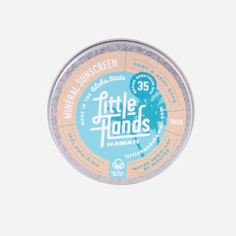 Little Hands Hawaii sunscreen tin on a white background