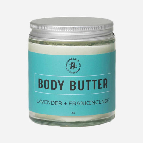Jar of body butter with lavender and frankincense scent on a white background