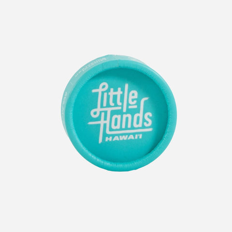 Turquoise lid with 'Little Hands Hawaii' text on a white background
