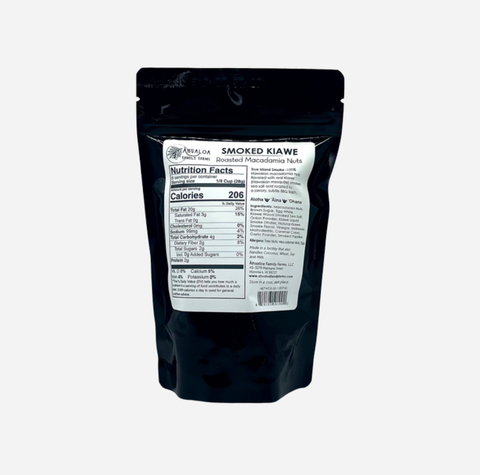 A black stand-up pouch of Alpha Labs Smoked Kiawe hemp flower extract, showing the back label with nutrition facts and product details on a light gray background.