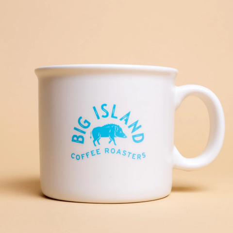White mug with 'Big Island Coffee Roasters' logo on a beige background