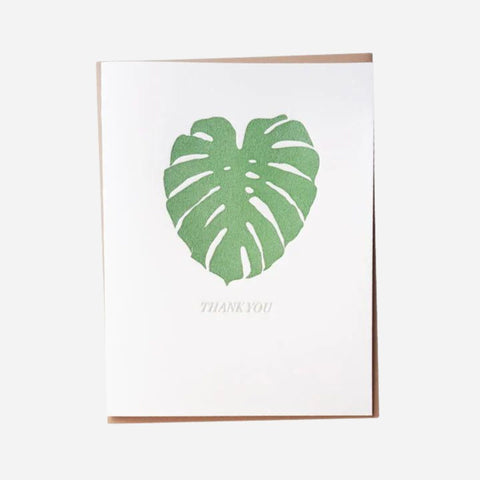 Card with a green leaf design and 'Thank You' text on a white background