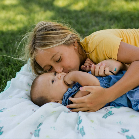 baby and girl on coco moon hawaii blanket