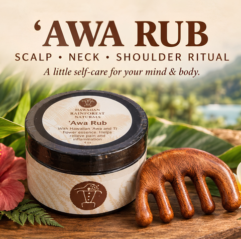 A jar of Hawaiian Rainforest Naturals 'Awa Rub' scalp, neck, and shoulder ritual balm is displayed on a wooden surface next to a wooden massage comb, with tropical leaves and a flower in the background. The image includes promotional text at the top.