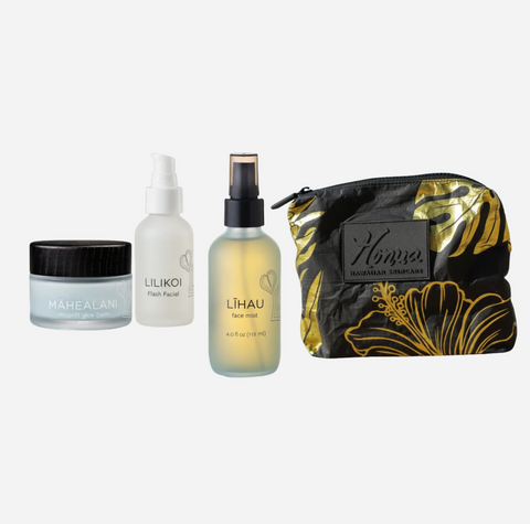 Four skincare products from Hava Hawaiian Skincare arranged on a light gray background: a Mahealani moisturizing cream jar, a Lilikoi facial cleanser bottle, a Lihau face mist bottle, and a black and gold floral zip pouch.