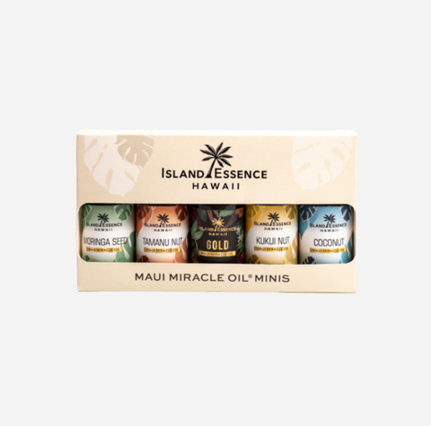 Island Essence Hawaii Maui Miracle Oil Minis set, containing four small essential oil bottles in a cream-colored gift box with tropical leaf designs.