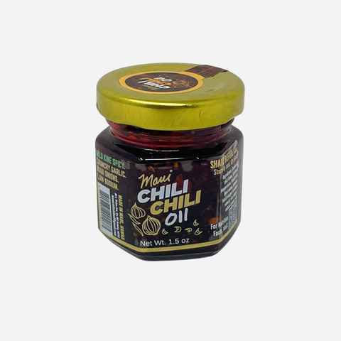 Jar of Maui Chili Chili Oil with a gold lid on a white background