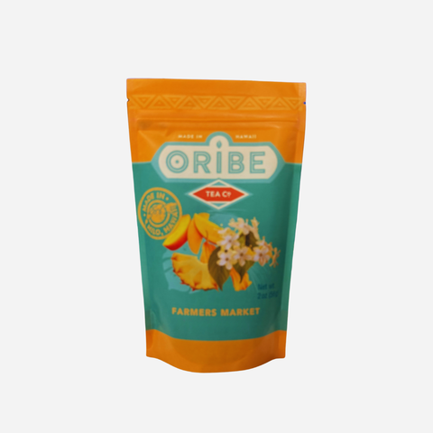 Oribe tea package with orange and teal design on a white background