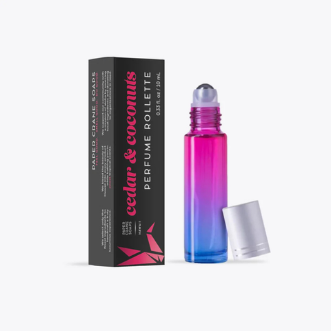 Perfume roller with gradient design and packaging on a white background