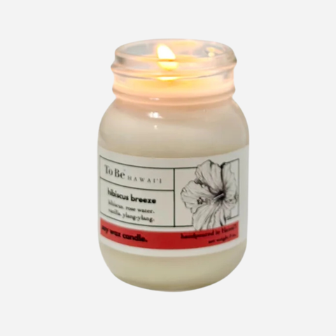 Candle in a jar with a label on a white background