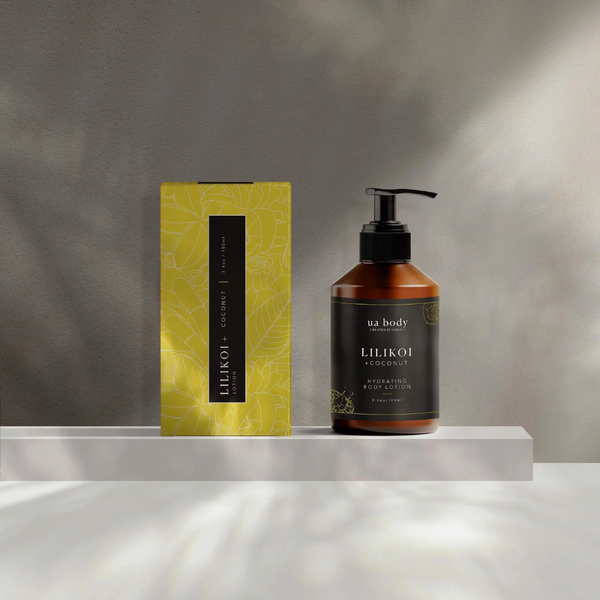 UA Body Lilikoi body lotion with packaging on a reflective surface