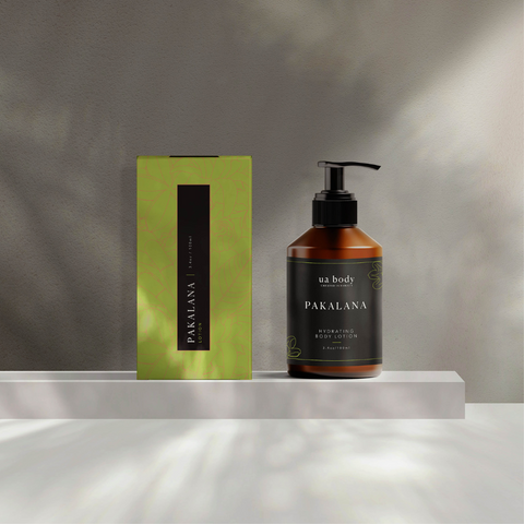 Pakalana body lotion and packaging on a neutral background
