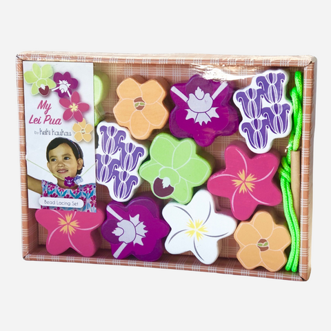 Colorful flower-shaped leis in a box with a card featuring a child's face.