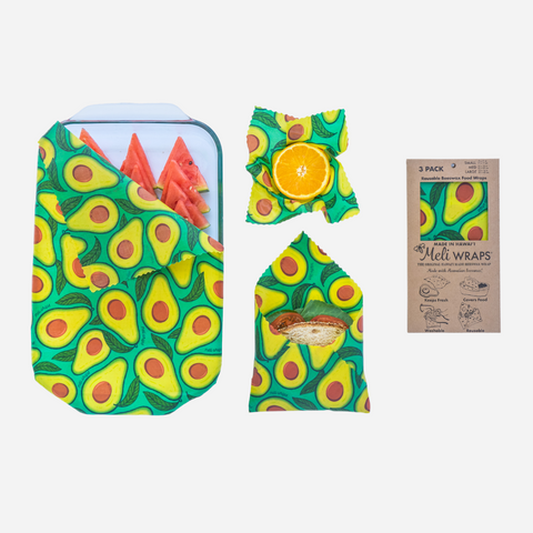 Avocado-patterned food wraps with a package of Meli Wraps on a white background