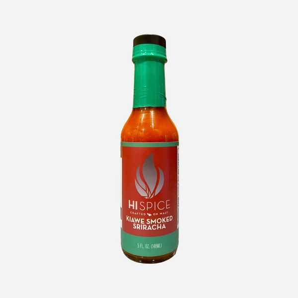 Bottle of Klawe Smoked Sriracha with a green cap and label on a white background