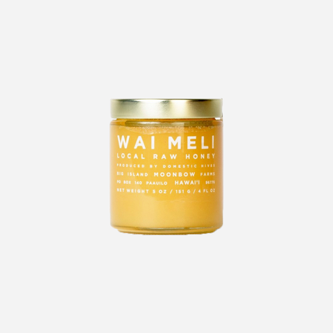 Jar of Waimeli local raw honey on a white background